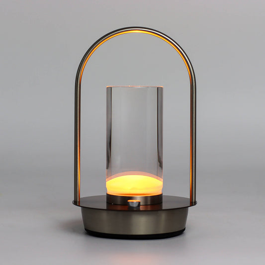 Modern crystal lantern-style touch lamp with a glass cover and metal handle on a gray background - Kraas