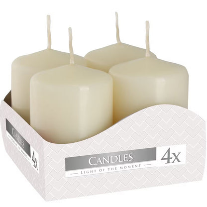 Set of four white ivory pillar candles in a box labeled 'Candles Light of the Moment' - Kraas