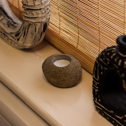 Handcrafted river stone candle holders for rustic and minimalist décor - Kraas