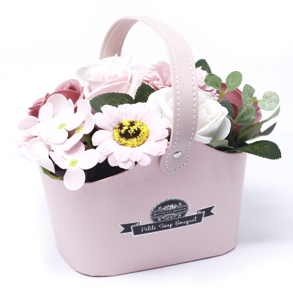 Elegant scented pink floral arrangement in a decorative basket with 'Petite Soap Boutique' for bridal showers and special occasions - Ancient Wisdom
