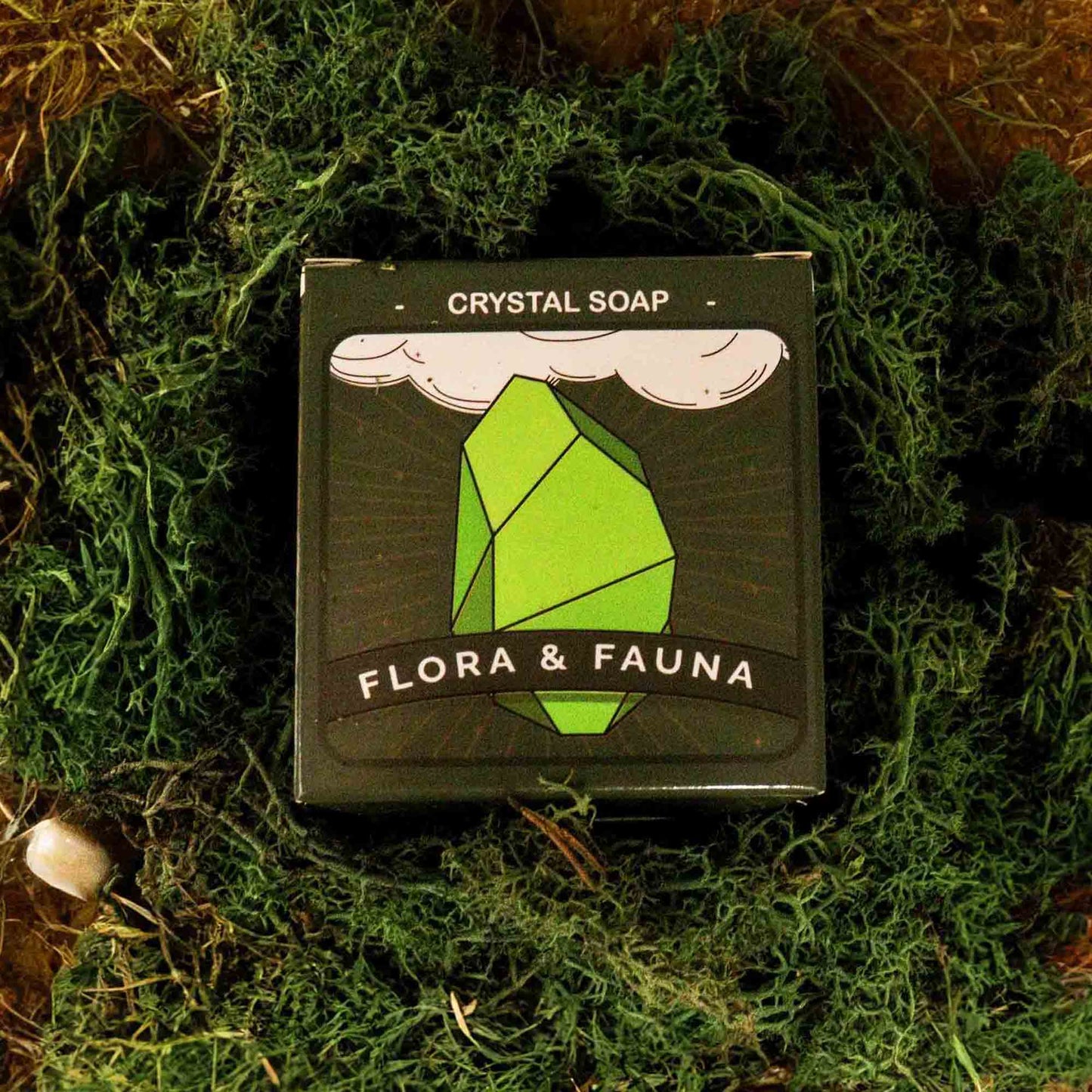 Crystal soap packaging with 'Flora & Fauna' branding on a green leafy background - Ancient Wisdom